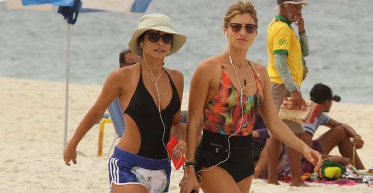 Grazi Massafera e Ana Lima fazem exercícios na praia