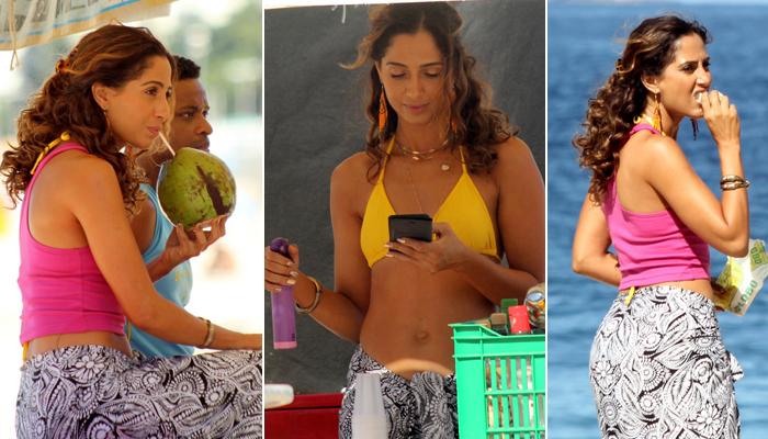 Camila Pitanga toma água de coco, checa celular e faz lanchinho enquanto grava ‘Babilônia’