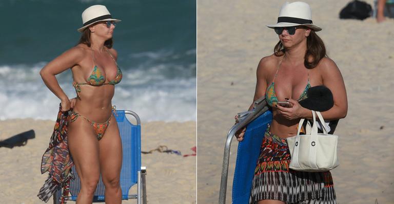 Viviane Araújo exibe a barriguinha chapada em dia na praia