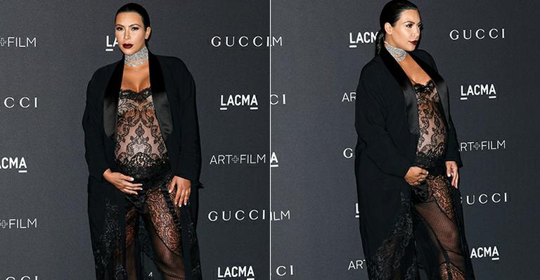 Na reta final da gravidez, Kim Kardashian aparece de macacão de renda transparente