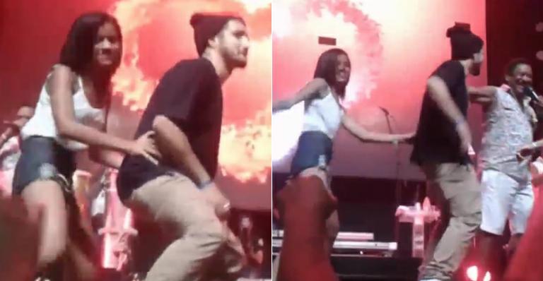 Sem Maria Casadevall, Caio Castro dança soltinho com fã em show