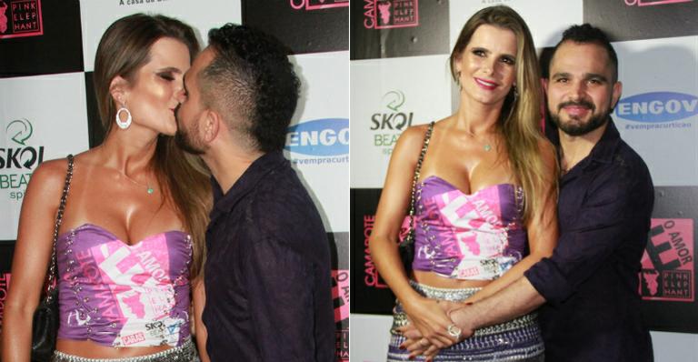 Bem mais magro, Luciano beija Flávia Fonseca em camarote no Rio