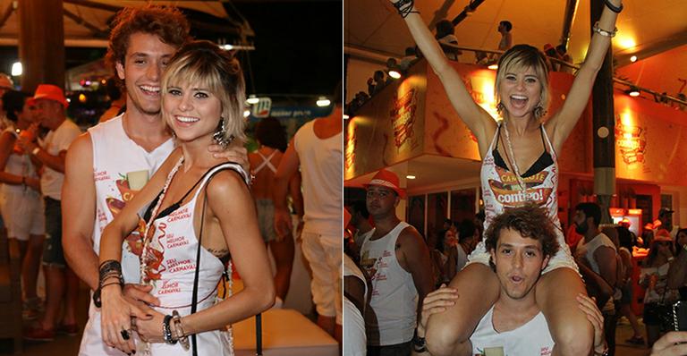 Julianne Trevisol é carregada pelo namorado em camarote vip