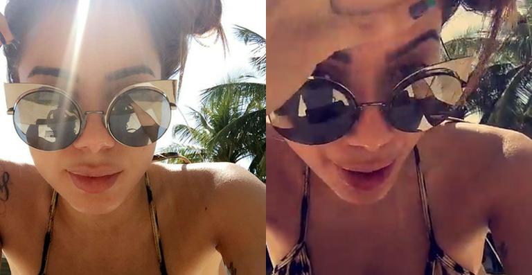 Anitta tenta aproveitar uma hora de folga no sol: ‘Tentei jogar o celular na piscina, mas era à prova d’água’