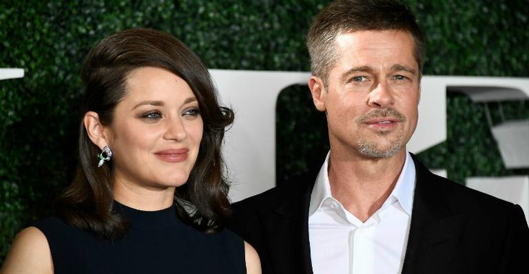 Brad Pitt posa ao lado de Marion Cotillard em première na Califórnia