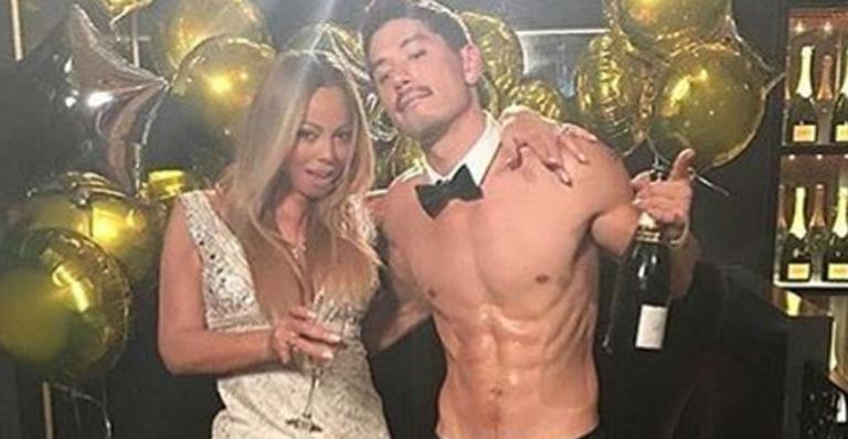 Um mês após fim do noivado, Mariah Carey é vista aos beijos com dançarino Bryan Tanaka
