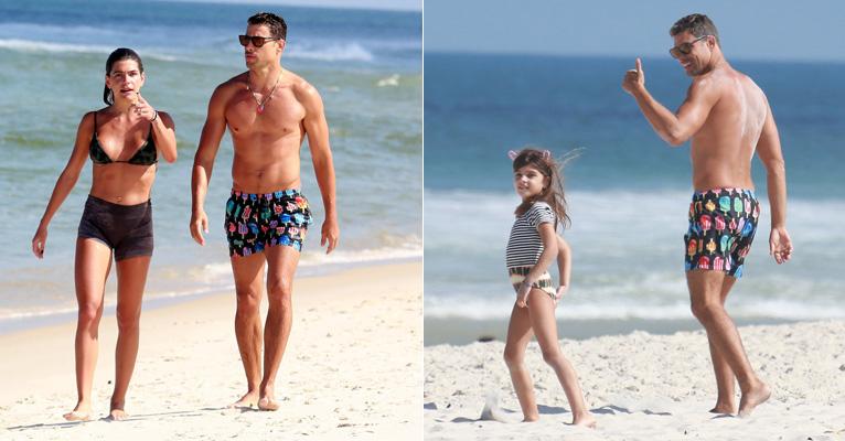 Cauã Reymond se diverte com Mariana Goldfarb e a filha, Sofia, em praia carioca
