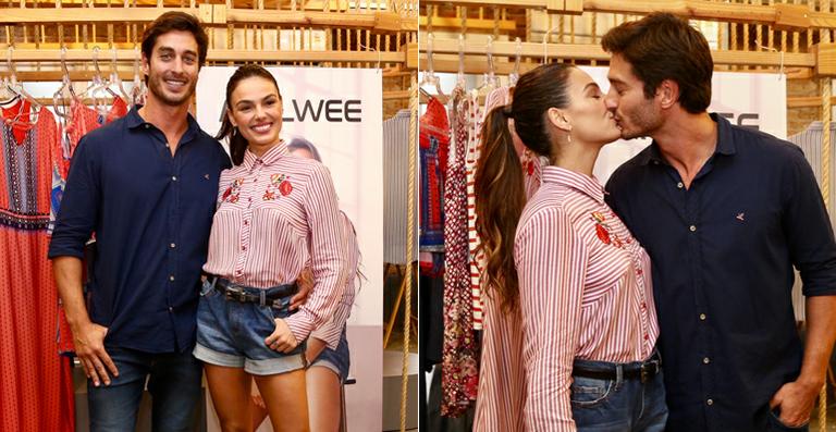 Isis Valverde curte o carinho do namorado em evento fashion