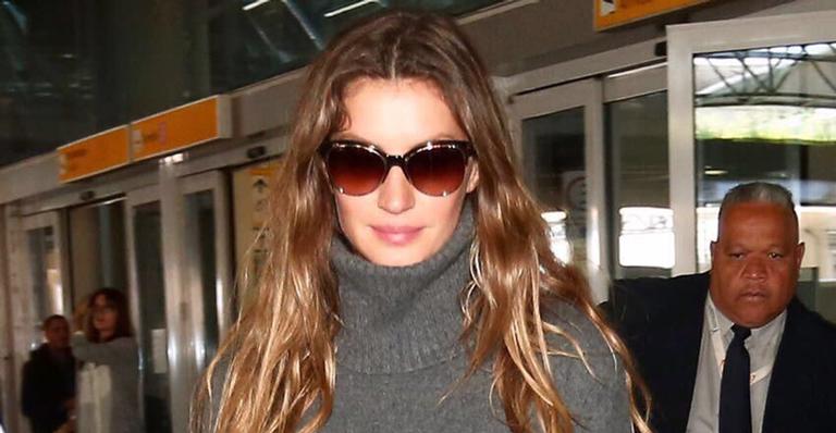 Rodeada de seguranças, Gisele Bündchen desembarca em São Paulo