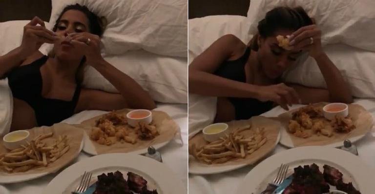 Após premiação, Anitta aparece só de sutiã jantando na cama