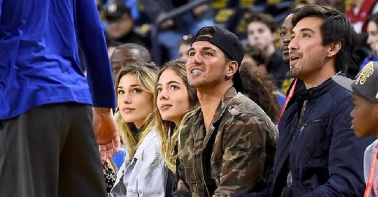 Sasha Meneghel e Gabriel Medina assistem jogo de basquete nos EUA