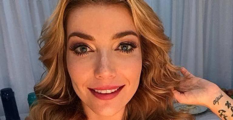 Em dia de sol, Luisa Possi exibe o barrigão de seis meses em biquíni