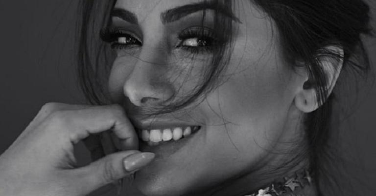 Anitta compartilha foto de tatuagem que fã fez do seu rosto
